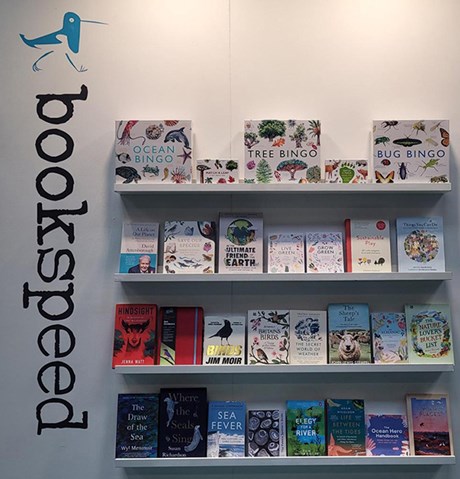 Books on shelves on a white background.