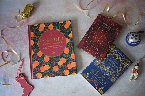 Festive books arranged on a flat surface.